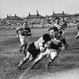 Alan Davies tackles Alan Taylor with Terry O’Grady and Harry Ogden in the background, while Walter Jones races in to …