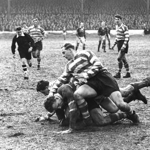Turner and Nestor tackle a Hornets player - March 22nd 1958.