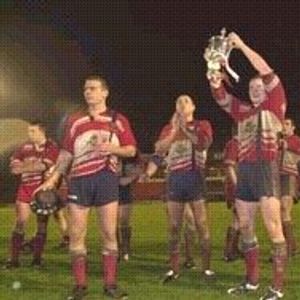 The players celebrate with the Law cup - Dec 29th 2002.