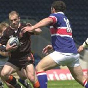 Oldham's Keith Brennan looks for a way through the Rochdale defence - June 29th 2003.
