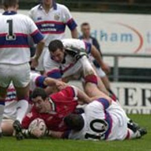 Oldham forward Lee Doran finds a way through a packed Rochdale defence to score the first try of the Law Cup game at …