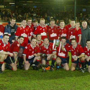 The players celebrate with the Law Cup - Jan 18th 2004.