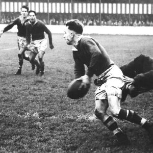 Frank Stirrup playing on the Salford left wing looks to pass before going into touch. Oldham v Salford - Oct 7th 1950.