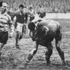 Billy Mitchell looks on as Dick Cracknell contests the ball with the Salford centre Cartwright - Dec 28th 1954.