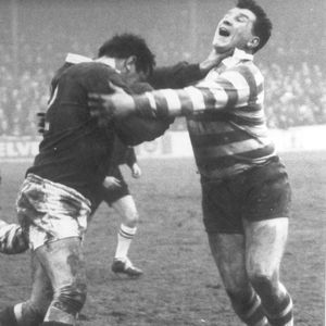 Peter Smethurst receives a hand-off from Evans of Salford as Geoff Crowther goes low - Jan 25th 1964.