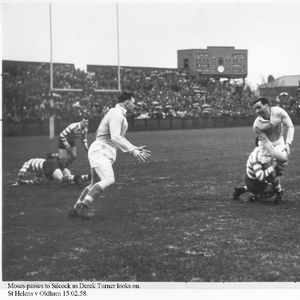 Glyn Moses prepares to pass to Nat Silcock as he is tackled while Derek Turner looks on - Feb 15th 1958.