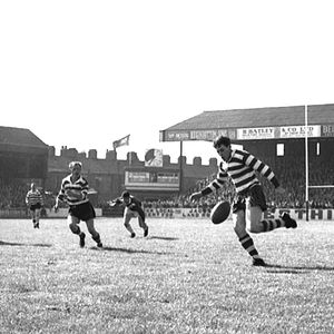 Malcolm Price kicks ahead against Swinton with Jack Pycroft and Ken Wilson in support - Aug 29th 1964.