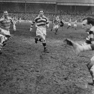 Joe Warham puts a kick over his opposite number v Widnes - March 18th 1950.