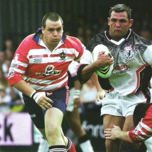 Tommy Hodgkinson takes a tackle from Phil Farrell as danny Guest closes in - July 28th 2001.