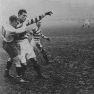Ernie Knapman releases a pass to Syd Rix before taking a tackle - Dec 6th 1924.