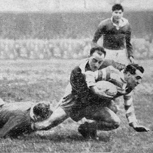 Dick Cracknell is tackled by Brian Nordgren and Jack Fleming - Nov 27th 1954.