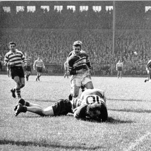Brian McTigue is brought down by an Oldham player with Bernard Ganley and Alan Davies in attendance - Sep 1st 1956.