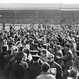 The crowd spill on to the pitch to congratulate the victorious Wigan team - March 8th 1958.