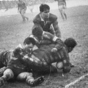Frank Collier is tackled by thee Oldham defenders - Jan 20th 1962.