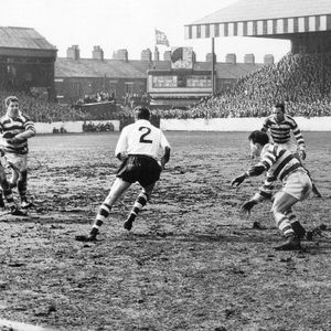 John Donovan, watched by Ray Fisher, takes on the Wigan defence of Frank Collier, Frank Pitchford and Stan McLeod - …