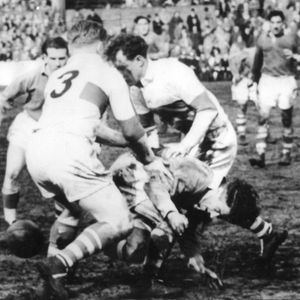Joe Silva falls to a two man Workington tackle - April 15th 1950.