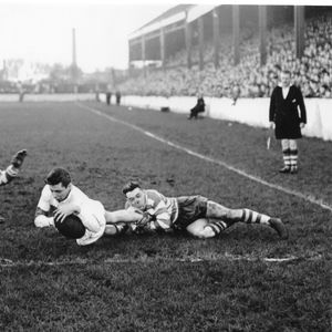 Bailey, the Workington left wing scores one of his two tries despite the tackle of Bernard Ganley and John Feather - Dec …