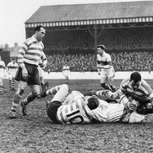 Alan Davies and Roger Dufty bring down Cec Thompson as Charlie Winslade looks on - April 26th 1958.