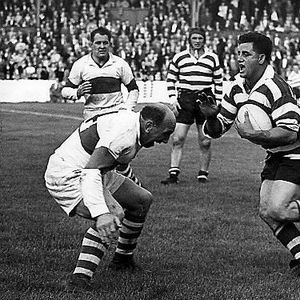 Derek Turner prepares to meet the tackle of Workington’s Billy Ivison - Sep 2nd 1958.