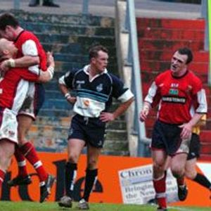Gavin Dodd (left) is congratulated by Gareth Barber on completing his hat-trick of tries - April 5th 2003..